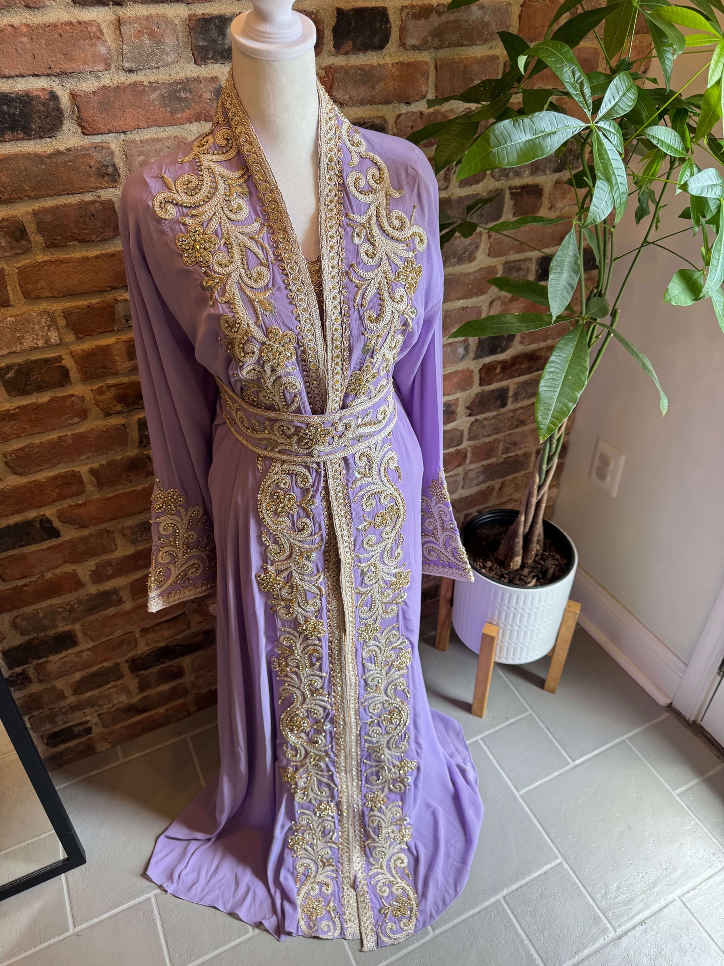 Elegant lavender kaftan with intricate crystal details shown from alternate front angle