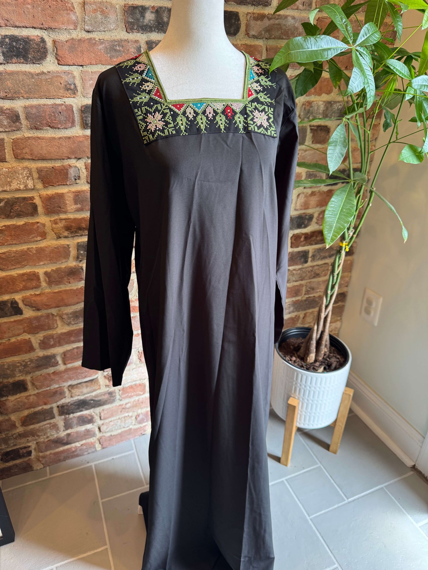 Front view of black inner dress from luxury abaya set with green embroidery – elegant modest fashion for women in the USA