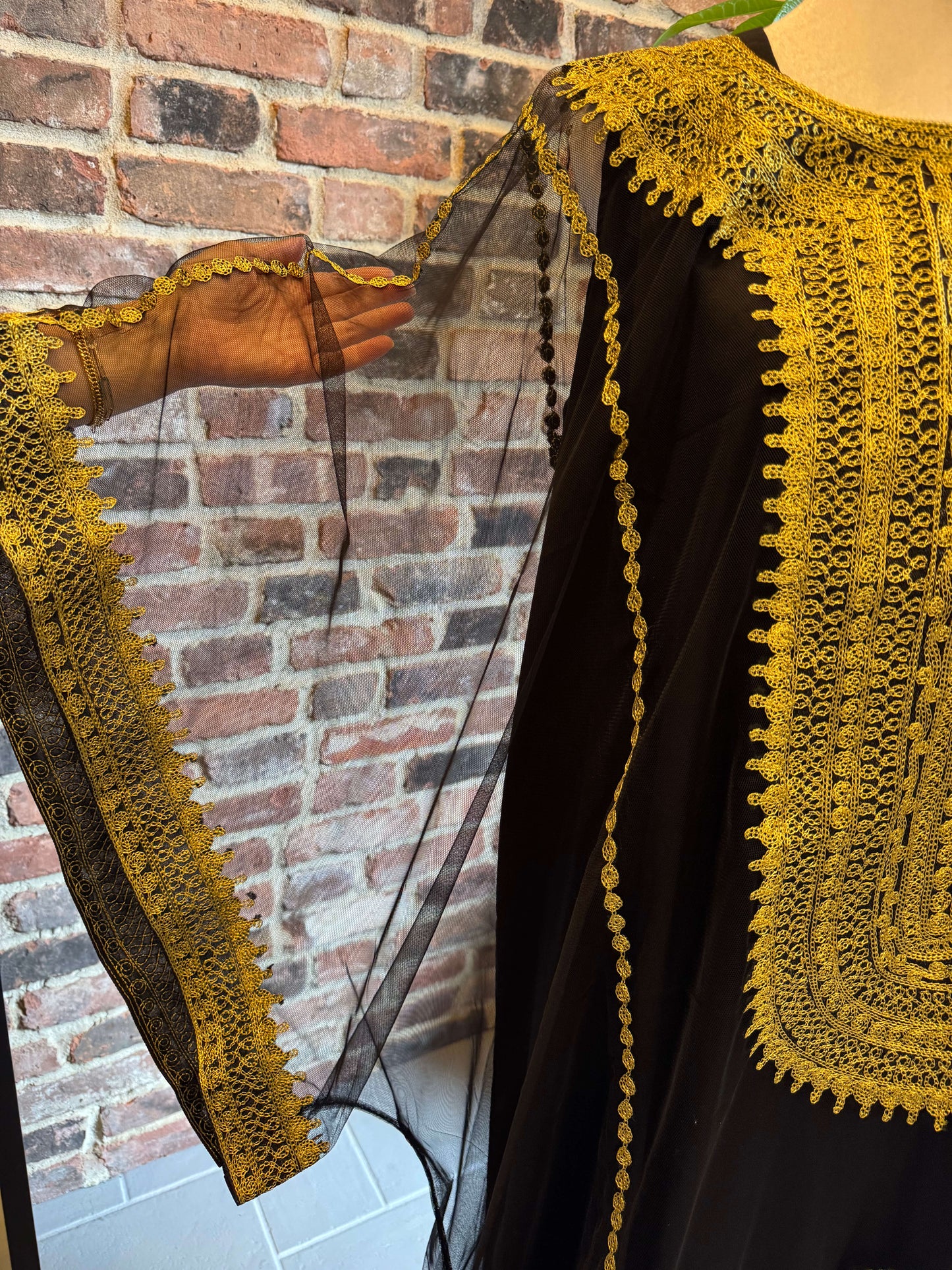 Sleeve view of Iraqi Hashimi Thobe Dress in black tulle with gold embroidery