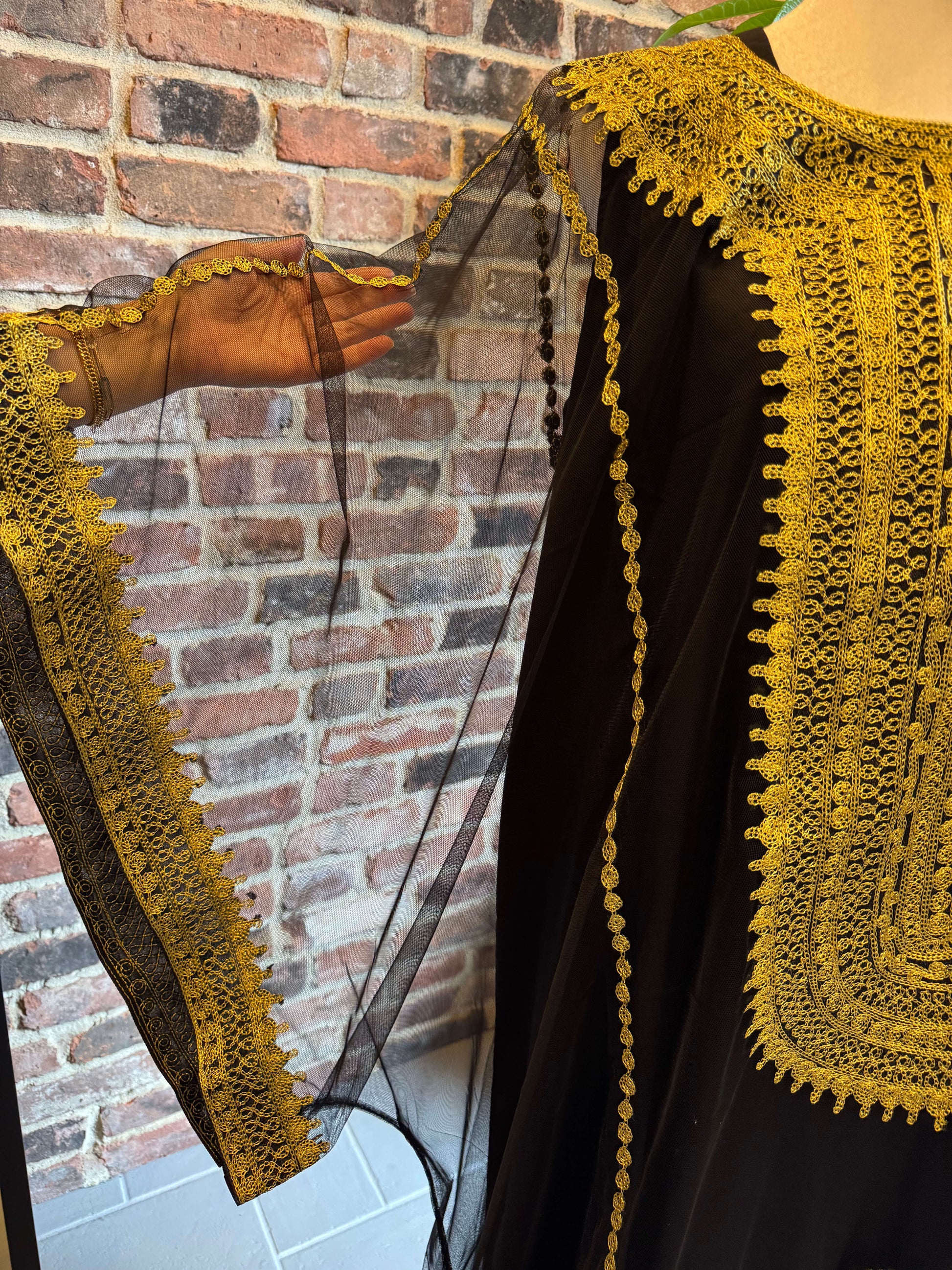 Sleeve view of Iraqi Hashimi Thobe Dress in black tulle with gold embroidery