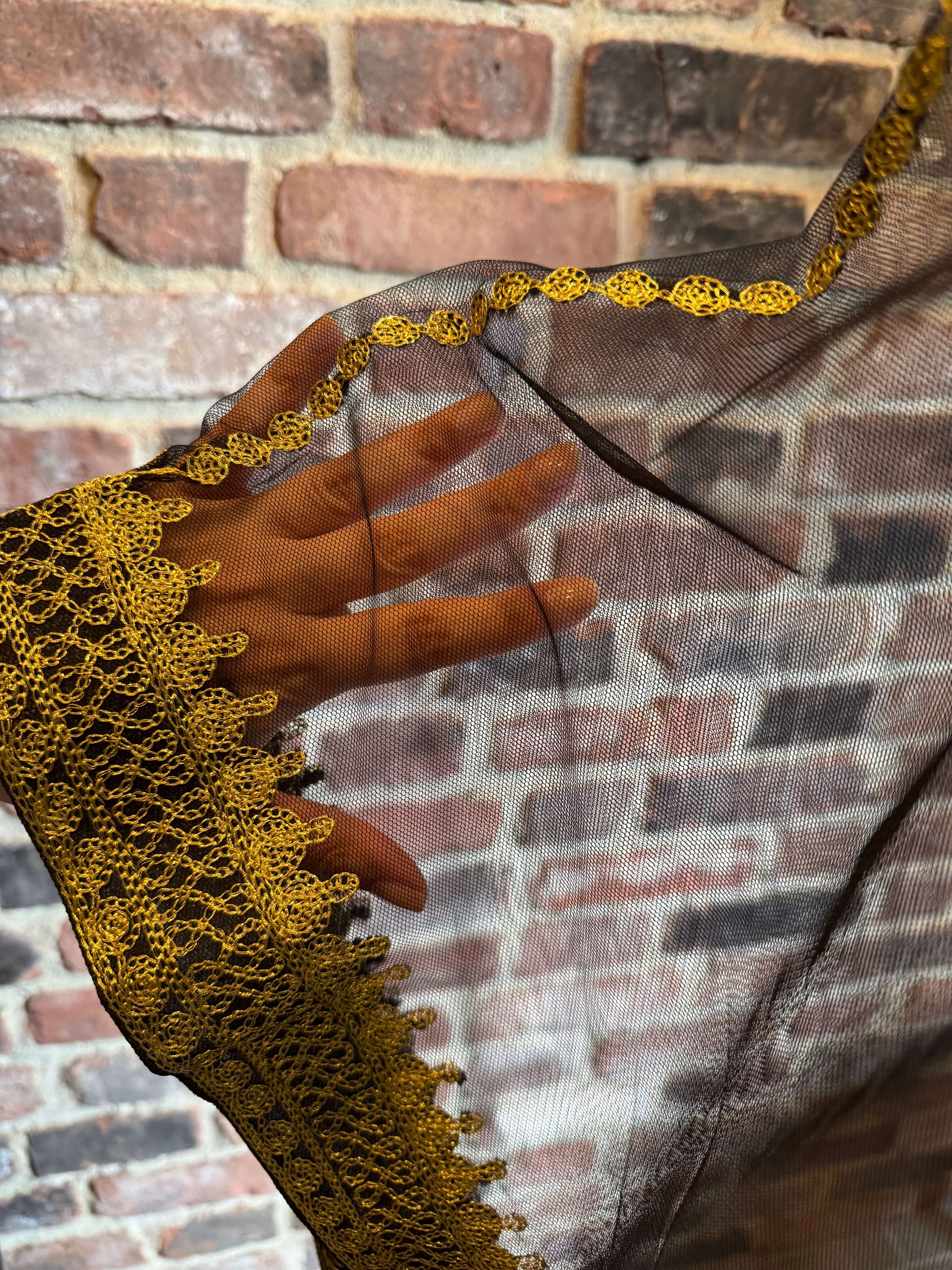 Sleeve view of Iraqi Hashimi Thobe Dress in black tulle with gold embroidery