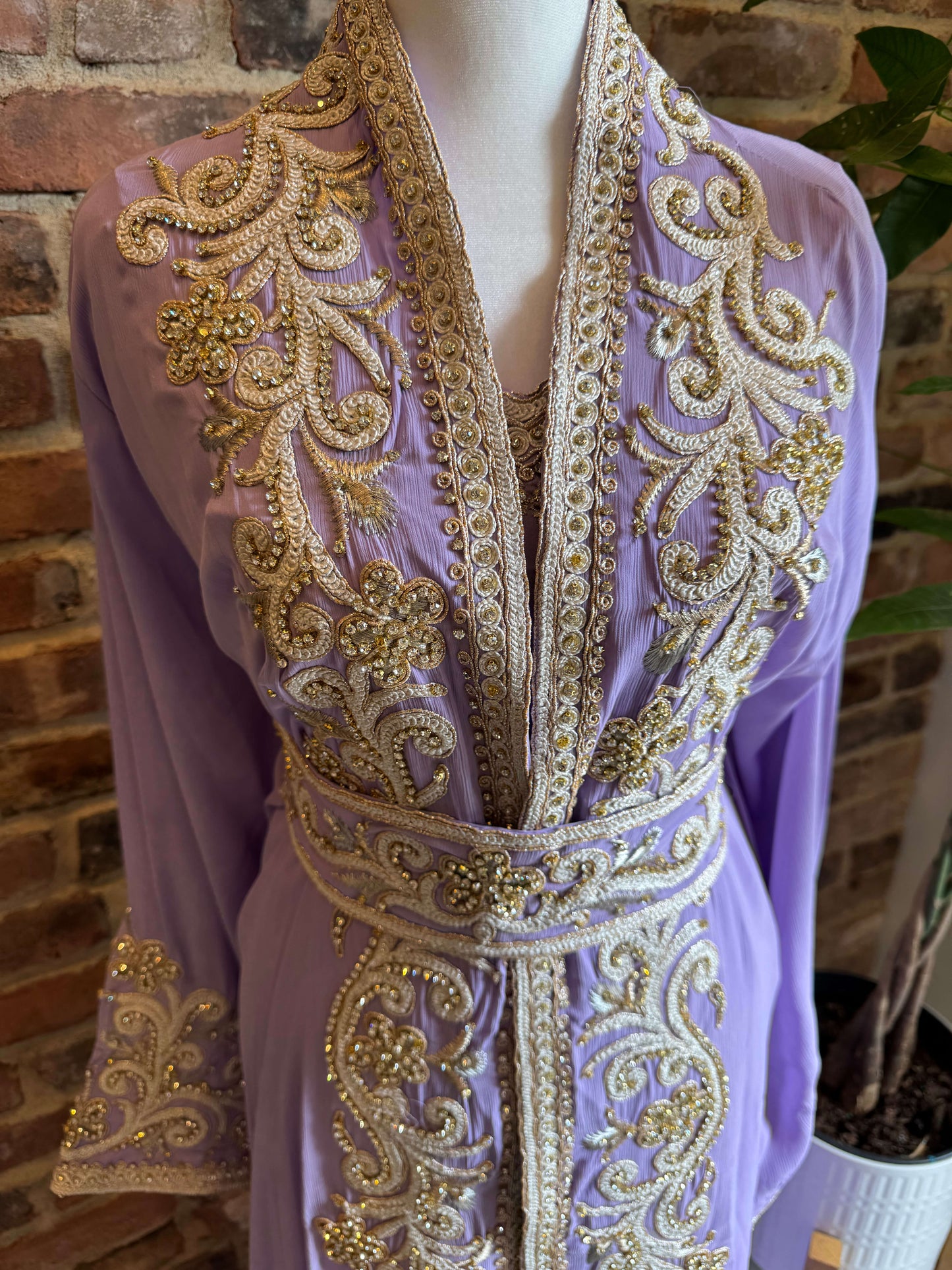 Close-up of crystal handwork on lavender evening kaftan, highlighting detailed embroidery