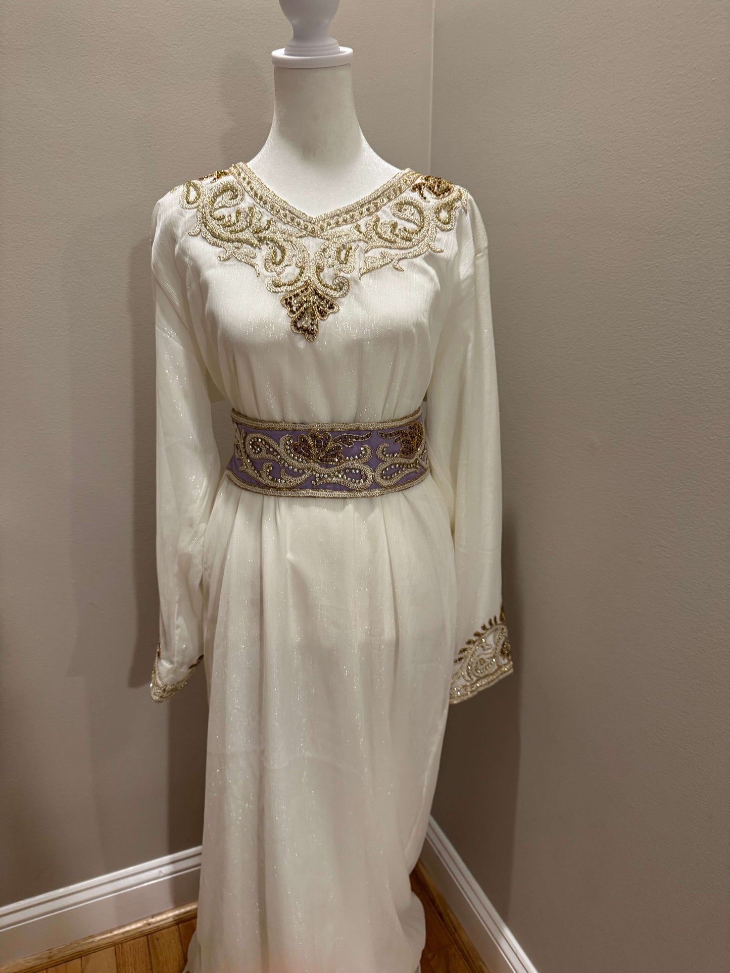 ineer dress of a luxury lavender kaftan with modest fit and sparkling embellishments