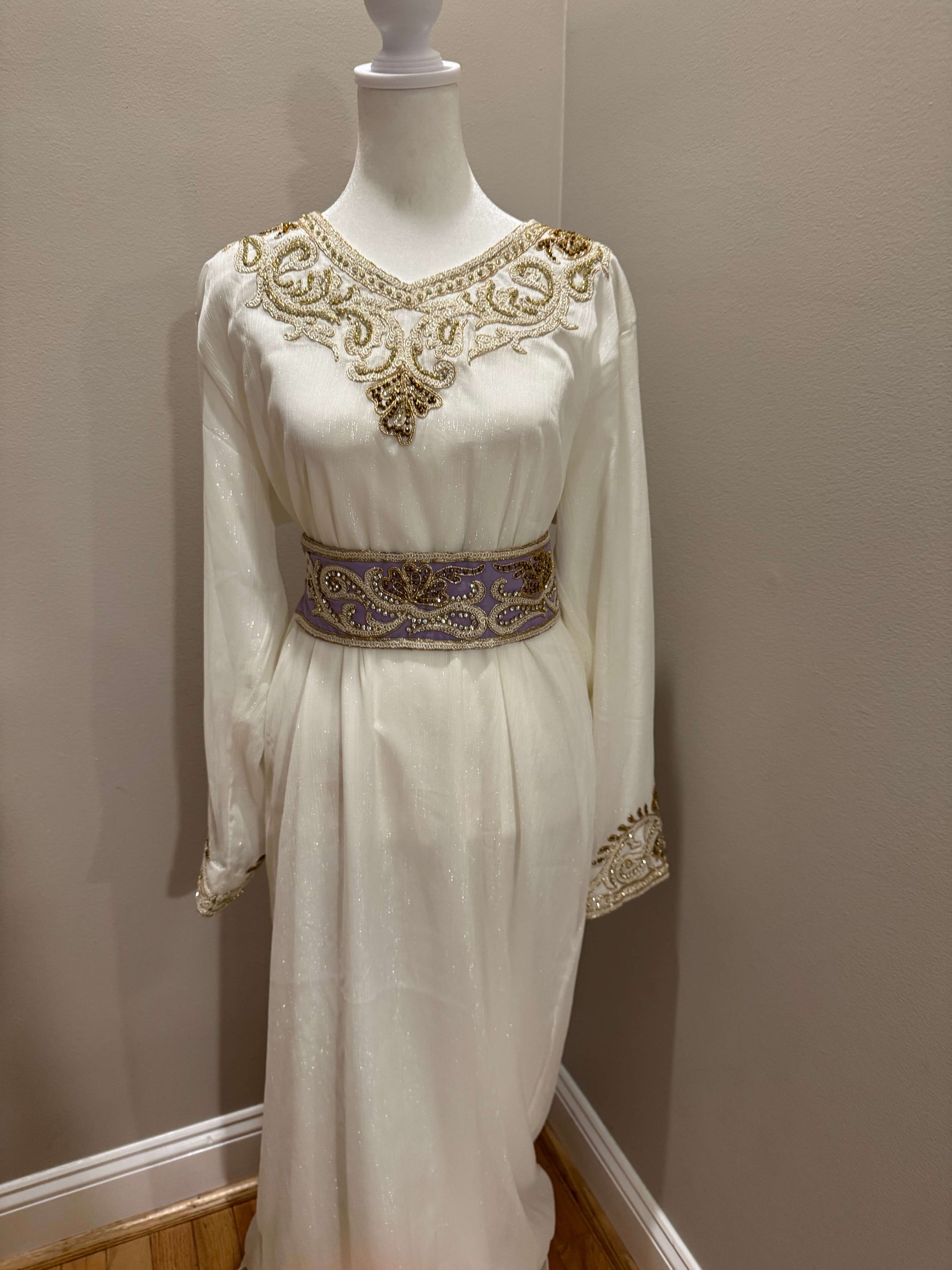 ineer dress of a luxury lavender kaftan with modest fit and sparkling embellishments